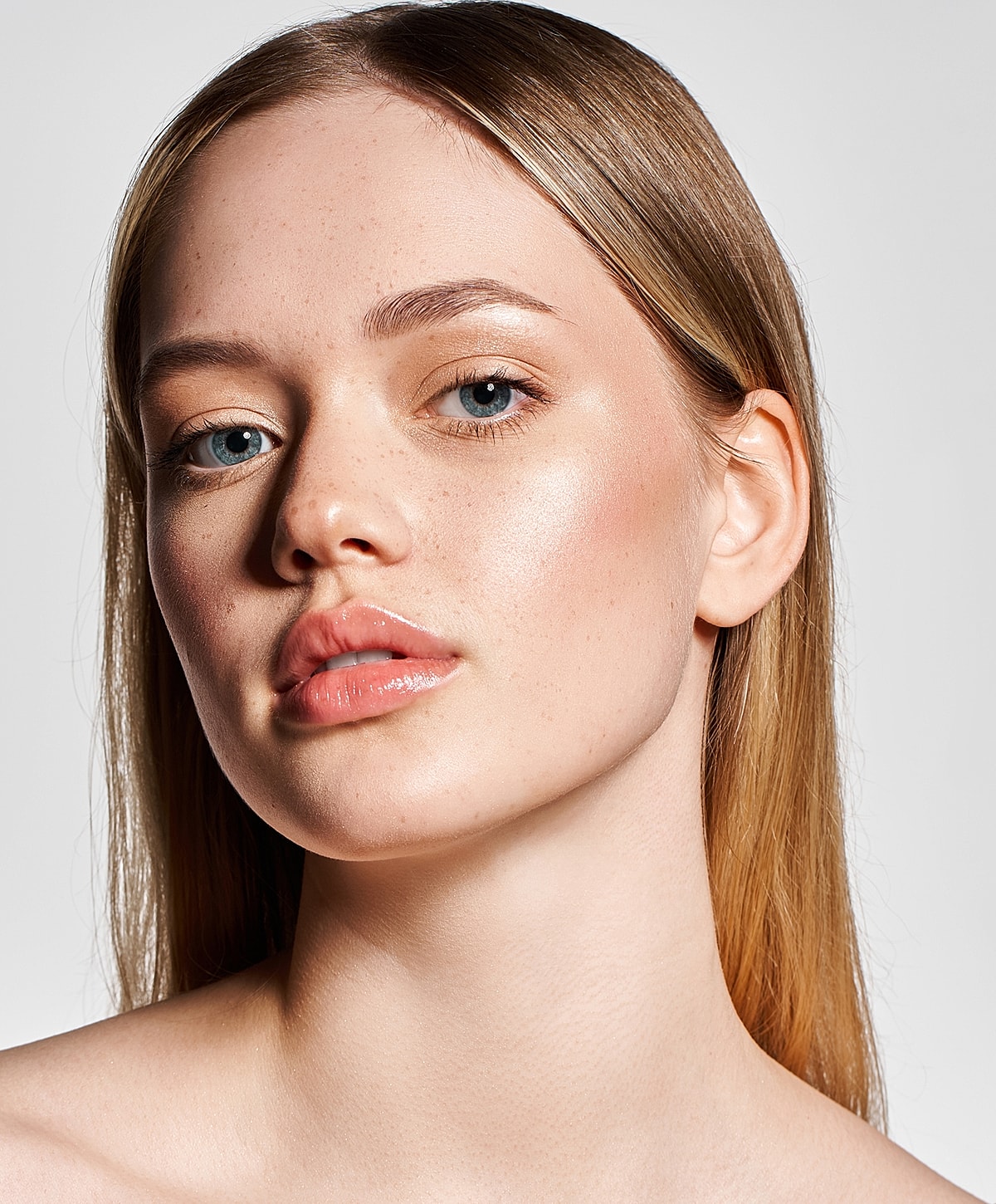 Close-up of woman with natural makeup and clear skin.