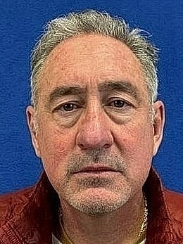 Mugshot of a middle-aged man with gray hair.
