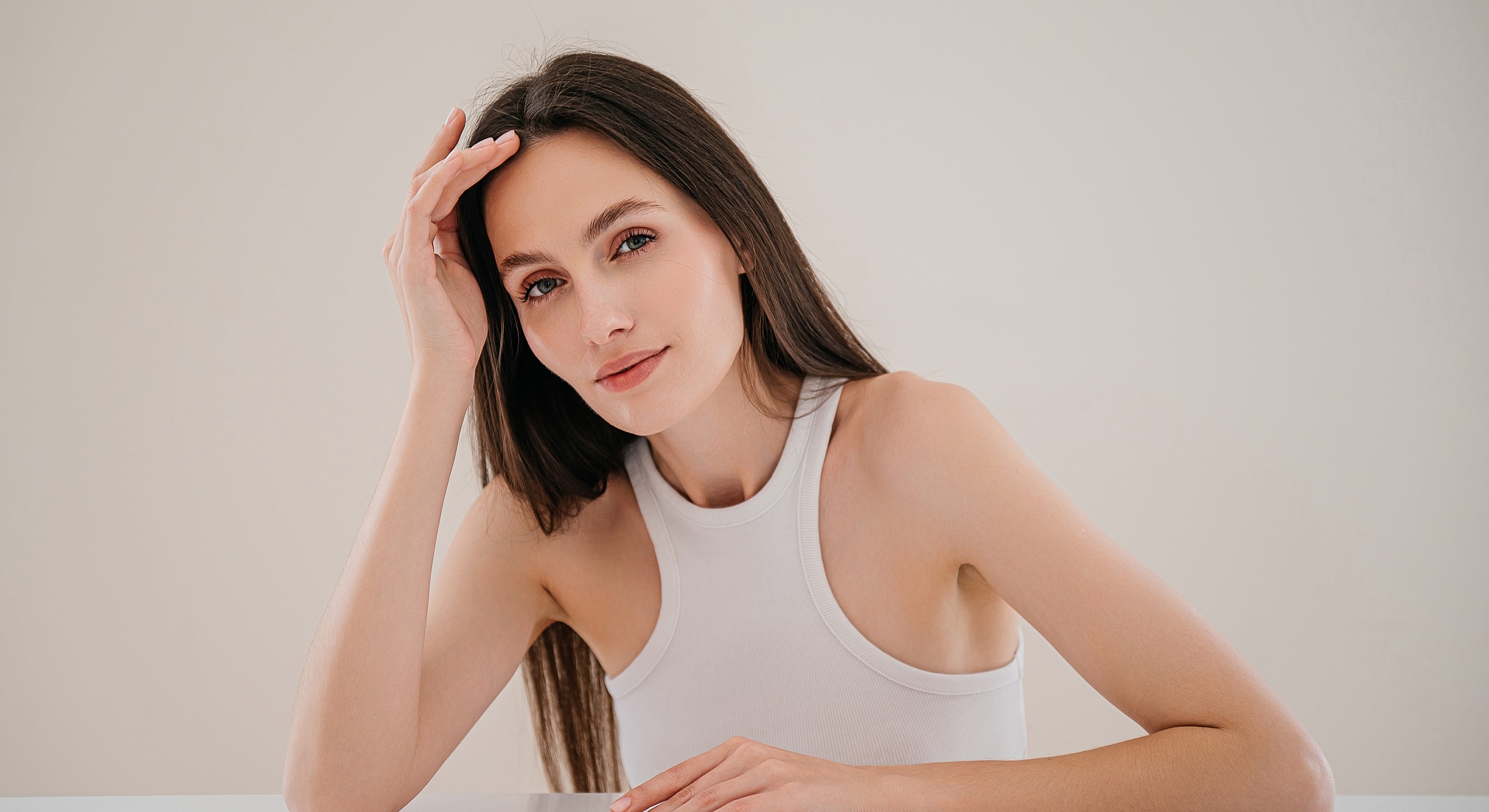 Woman with long hair in casual outfit.